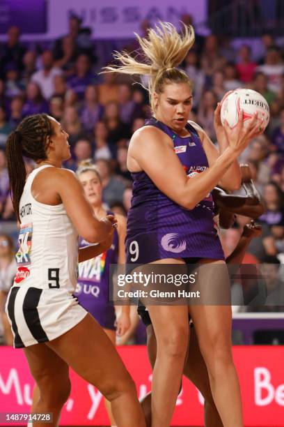 Donnell Wallam of the Firebirds controls the ball during the round eight Super Netball match between Queensland Firebirds and Collingwood Magpies at...