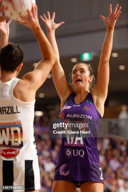 Lara Dunkley of the Firebirds defends Ash Brazill of the Magpies during the round eight Super Netball match between Queensland Firebirds and...