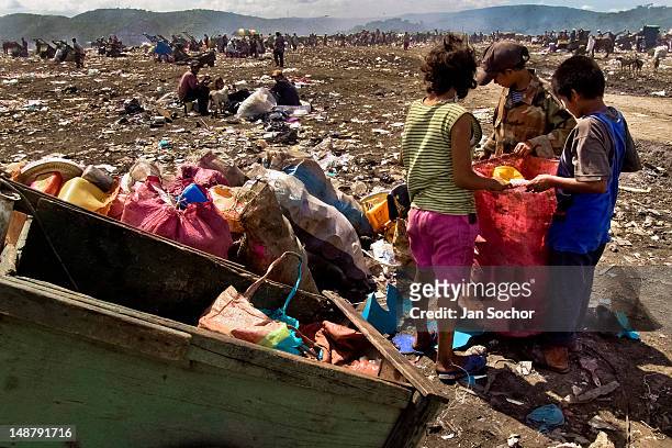 Nicaraguan family members recollect plastic garbage for recycling in the garbage dump La Chureca on 04 November 2004 in Managua, Nicaragua. La...