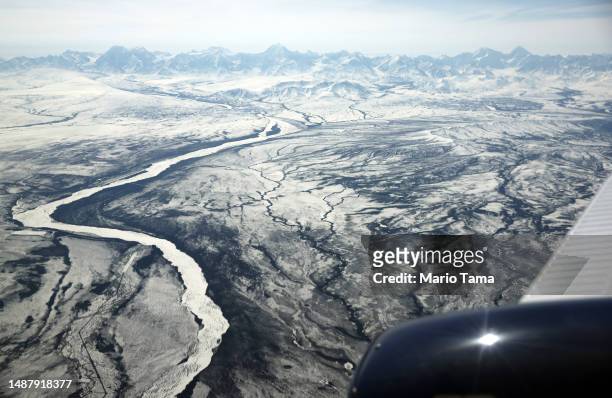 The Alaska Range is viewed from a NASA SnowEx campaign aircraft, which is studying changes in snow albedo in the Interior Alaska region during the...