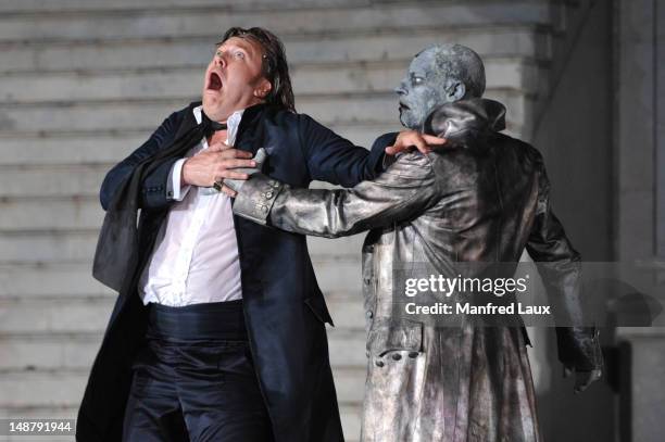 From left: Nicholas Ofczarek and Ben Becker is seen during the photo rehearsal of 'Jedermann' on the Domplatz ahead of Salzburg Festival 2012 on July...