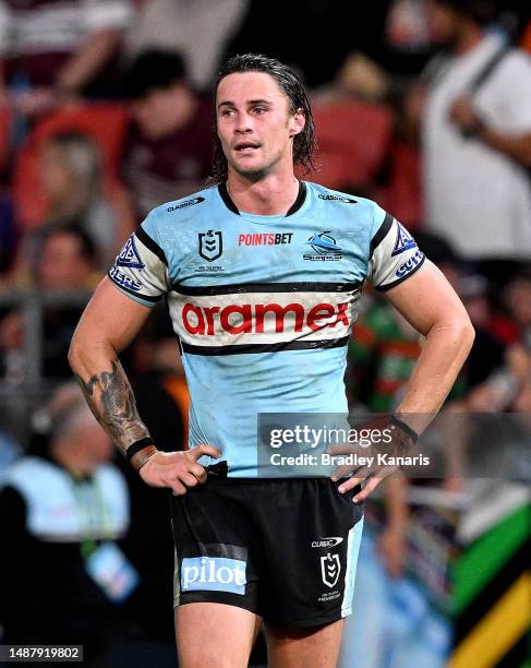 Nicho Hynes of the Sharks looks dejected after his team loses the round 10 NRL match between Cronulla Sharks and Dolphins at Suncorp Stadium on May...