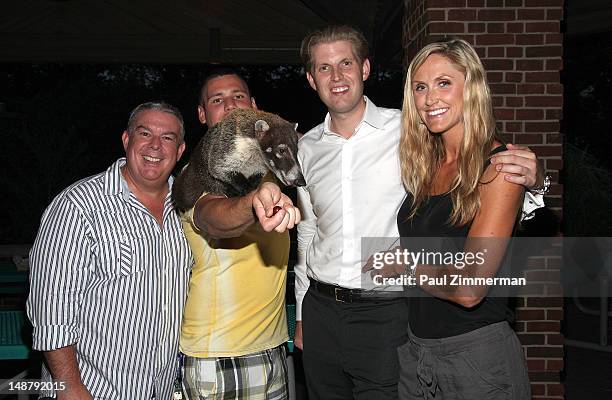 Elvis Duran, Alex Carr, Eric Trump and Lara Yunaska attend the Staten Island Zoo "National Zookeeper Week" Celebration Hosted By Elvis Duranat Staten...