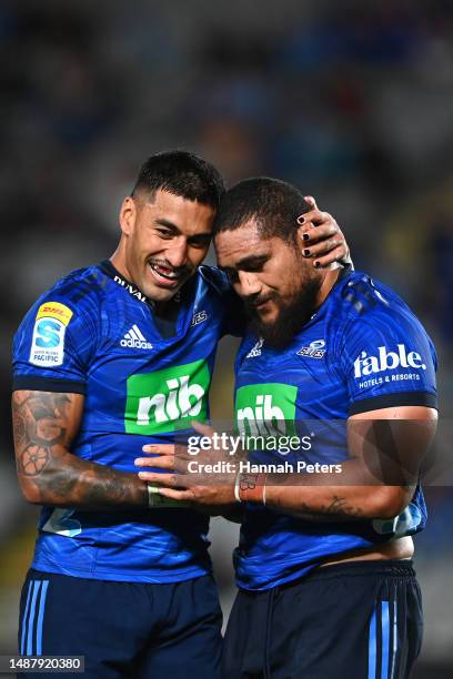Rieko Ioane celebrates with Ofa Tu'ungafasi of the Blues after winning the round 11 Super Rugby Pacific match between the Blues and Moana Pasifika at...