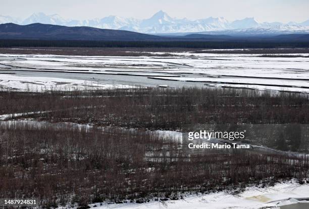 View of a boreal forest in front of Alaska Range mountains during the snowmelt season on May 5, 2023 near Delta Junction, Alaska. The NASA SnowEx...
