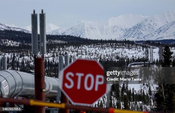 Part of the Trans Alaska Pipeline System runs through boreal forest past Alaska Range mountains on May 5, 2023 near Delta Junction, Alaska. The...