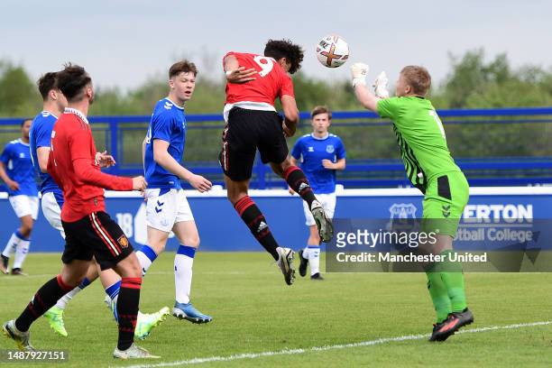 Ethan Wheatley of Manchester United scores their sides first goal during the U18 Premier League match between Everton and Manchester United at Finch...
