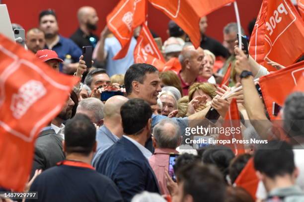 The President of the Government of Spain and Secretary General of the PSOE, Pedro Sanchez, greets socialist supporters on his arrival at a...