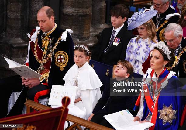 Britain's Prince William, Prince of Wales, Princess Charlotte, Prince Louis and Britain's Catherine, Princess of Wales attend the Coronation of King...