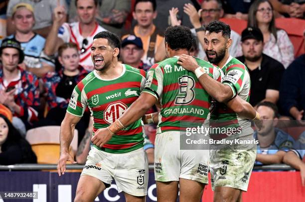 Alex Johnston of the Rabbitohs celebrates with team mates Cody Walker and Isaiah Tass of the Rabbitohs after scoring a try during the round 10 NRL...