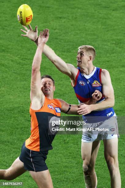 Jesse Hogan of the Giants is challenged by Tim English of the Bulldogs during the round eight AFL match between Greater Western Sydney Giants and...