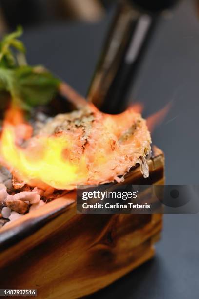 grilling a scallop with a blow torch - blow torch stock pictures, royalty-free photos & images