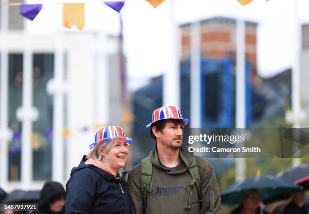 People watch the Coronation of King Charles III and Queen Camilla on a big screen in Centenary Square during the Coronation of King Charles III and...