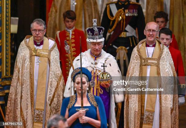 King Charles III departs the Coronation service at Westminster Abbey on May 06, 2023 in London, England. The Coronation of Charles III and his wife,...