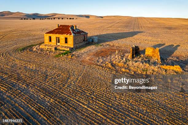 the "midnight oil house" near burra, south australia at sunset - paddock stock pictures, royalty-free photos & images