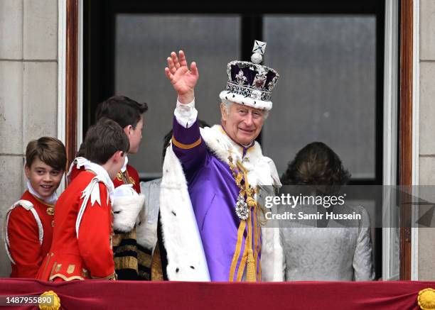 King Charles III waves from the Buckingham Palace balcony during the Coronation of King Charles III and Queen Camilla on May 06, 2023 in London,...