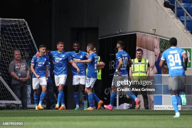 Christoph Baumgartner of TSG Hoffenheim celebrates with team mates after scoring their sides first goal during the Bundesliga match between TSG...