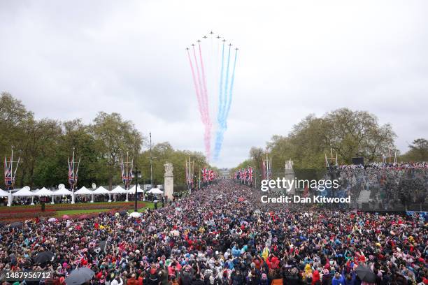 The Royal Air Force Aerobatic Team otherwise known as The Red Arrows fly over The Mall during the Coronation of King Charles III and Queen Camilla on...