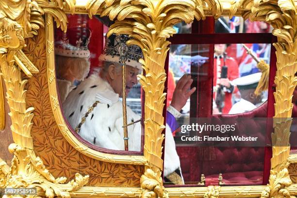 King Charles III and Queen Camilla travel in the Gold State Coach from Westminster Abbey on route to Buckingham Palace after the Coronation on May...