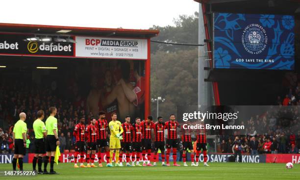 Players of AFC Bournemouth, fans and officials stand for the national anthem for the Coronation of Charles III and Camilla prior to the Premier...