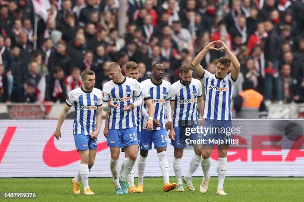Marc-Oliver Kempf of Hertha Berlin celebrates with teammates after scoring the team's first goal during the Bundesliga match between Hertha BSC and...