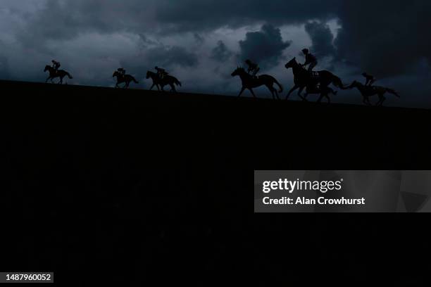General view as runners ease down up the hill after finishing The Howden Handicap at Newmarket Racecourse on May 06, 2023 in Newmarket, England.