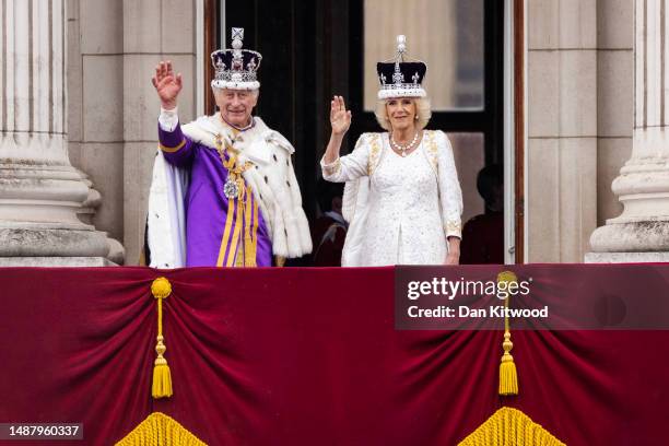 King Charles III and Queen Camilla wave from The Buckingham Palace balcony after the Coronation of King Charles III and Queen Camilla on May 06, 2023...