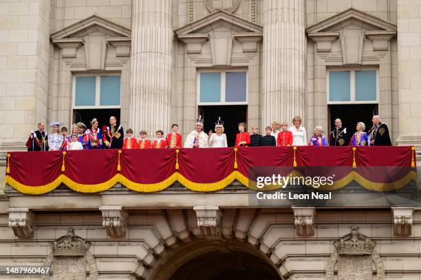 King Charles III and Queen Camilla wave from the balcony of Buckingham Palace with the rest of the Royal family during the Coronation of King Charles...