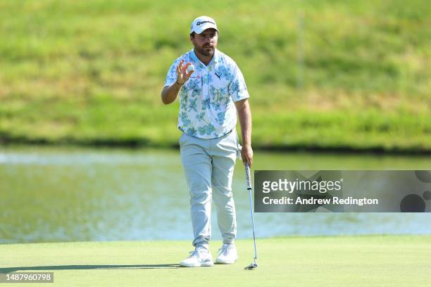 Romain Langasque of France acknowledges spectators on the 18th green during Day Three of the DS Automobiles Italian Open at Marco Simone Golf Club on...