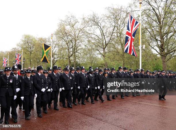 Ceremonial Metropolitan Police Officers walk down The Mall during the Coronation of King Charles III and Queen Camilla on May 06, 2023 in London,...