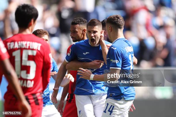 Andrej Kramaric of TSG Hoffenheim celebrates with team mates after scoring their sides second goal from the penalty spot during the Bundesliga match...