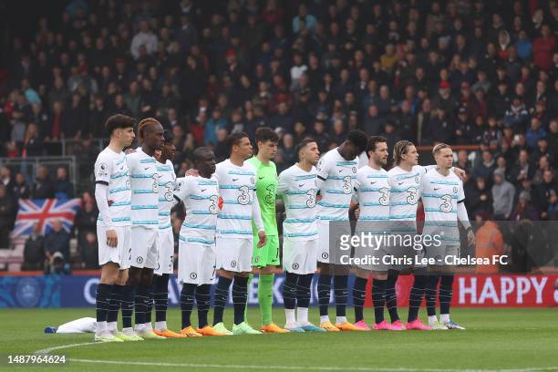 Players of Chelsea, fans and officials stand for the national anthem for the Coronation of Charles III and Camilla prior to the Premier League match...