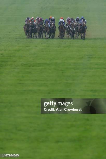 General view as runners make their way down the course during The Howden Suffolk Stakes at Newmarket Racecourse on May 06, 2023 in Newmarket, England.