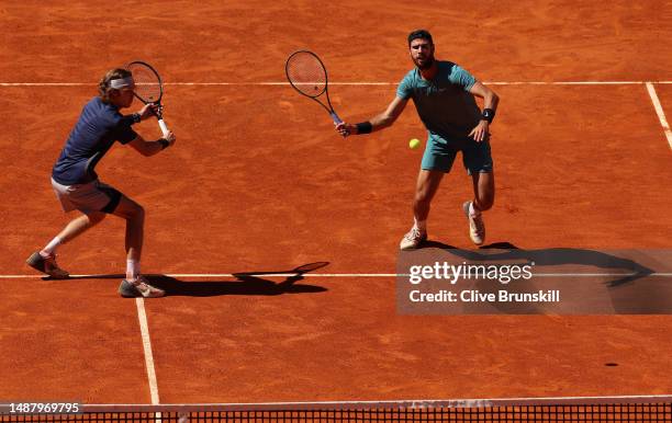 Andrey Rublev and Karen Khachanov in action against Rohan Bopanna of India and Matthew Ebden of Australia during the Mens doubles final match on Day...