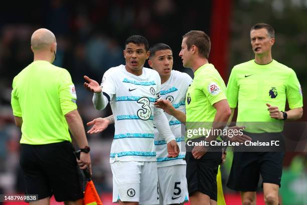 Thiago Silva and Enzo Fernandez of Chelsea interact with match referee John Brooks at half time during the Premier League match between AFC...