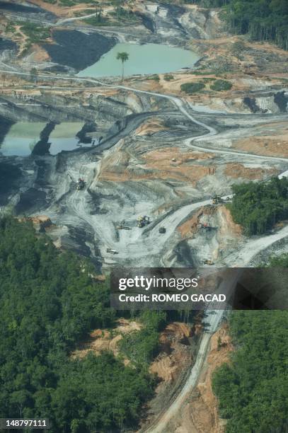 To go with AFP story Indonesia-France-environment-animal,FEATURE by Loic Vennin This aerial photograph taken on June 7, 2012 shows a coal mining...