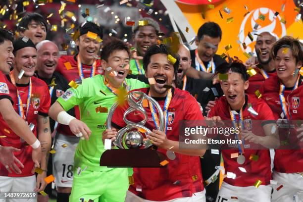 Shinzo Koroki of Urawa Red Diamonds lifts the trophy after winning the AFC Champions League final second leg between Urawa Red Diamonds and Al-Hilal...