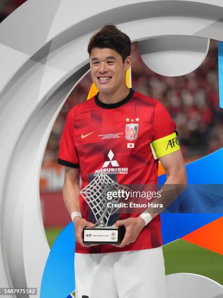 Hiroki Sakai of Urawa Red Diamonds receives Most Valuable Player trophy during the medal ceremony following the AFC Champions League final second leg...