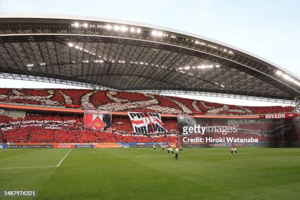 Fans of Urawa Red Diamonds cheer prior to the AFC Champions League final second leg between Urawa Red Diamonds and Al-Hilal at Saitama Stadium on May...