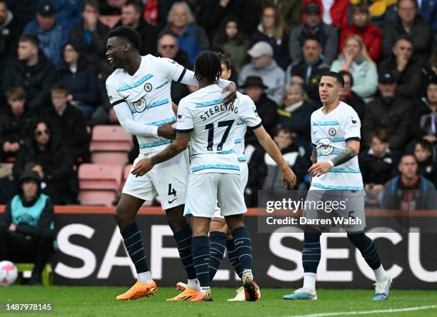 Benoit Badiashile of Chelsea celebrates with team mate Raheem Sterling after scoring their sides second goal during the Premier League match between...