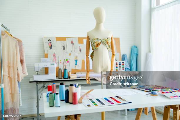 empty room show accessories and equipment for tailor or dressmaker in workplace room and day light - atelier fashion stock pictures, royalty-free photos & images