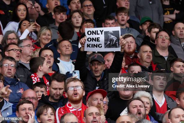 Fan of Liverpool holds up a sign which reads 'Only One King' with a picture of Former Footballer, Kenny Dalglish prior to the Premier League match...