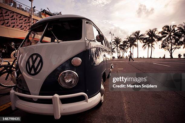 volkswagen combi van on waikiki boulevard. - volkswagen stock pictures, royalty-free photos & images