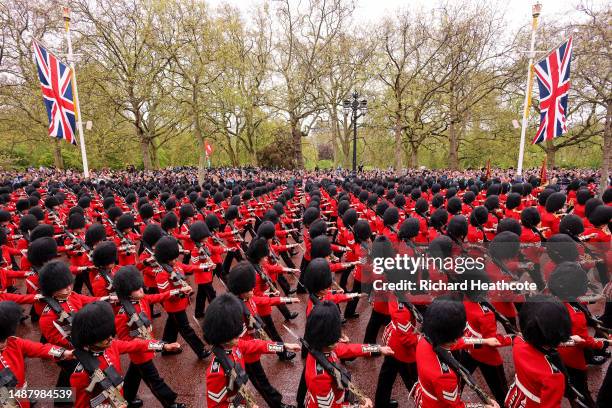 Coldstream Guards march along The Mall ahead of the golden state coach during the Coronation of King Charles III and Queen Camilla on May 06, 2023 in...