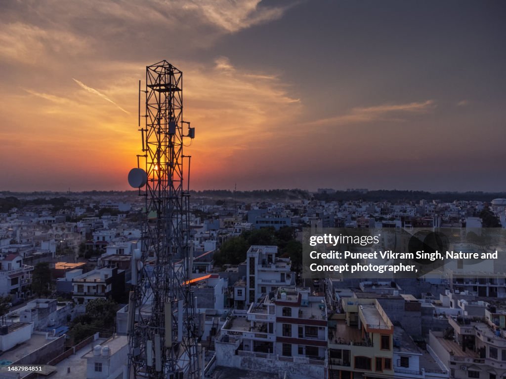 5G and 4G connectivity in the backdrop of sunset in a densely populated developing City