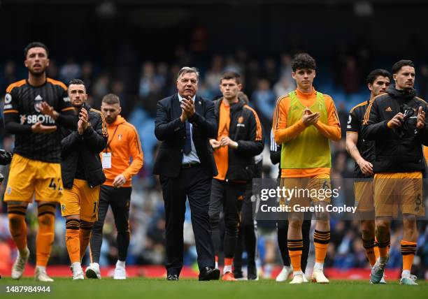 Sam Allardyce, Manager of Leeds United, and players of Leeds United applaud fans after the Premier League match between Manchester City and Leeds...