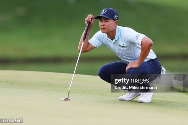 Justin Suh of the United States lines up a putt on the 14th green during the third round of the Wells Fargo Championship at Quail Hollow Country Club...