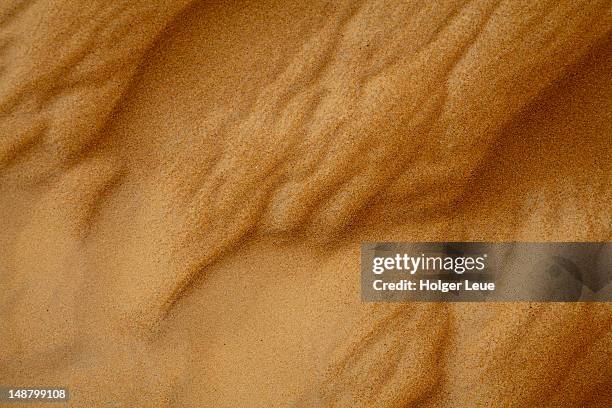 detail of sand in wahiba sands desert. - zand stockfoto's en -beelden