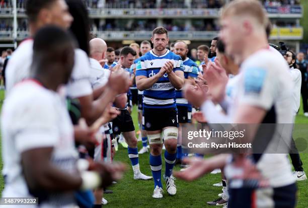 Dave Attwood of Bath Rugby leads the team through a tunnel formed by players of Saracens after making their final career appearance during the...