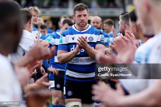 Dave Attwood of Bath Rugby leads the team through a tunnel formed by players of Saracens after making their final career appearance during the...